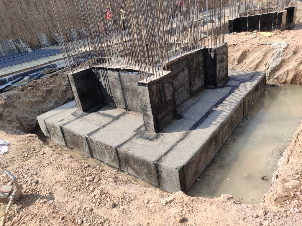 Concrete footing and foundation wall waterproofing